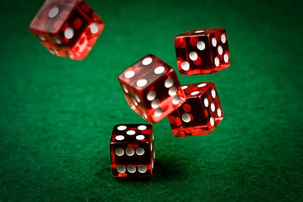Live Sic Bo table with three dice, payout table, and betting layout