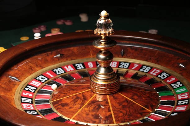 Roulette wheel and betting layout with chip placement